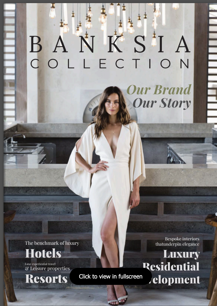 Banksia Collection portfolio cover: Ros Banksia-Smith in a white dress in a calm hospitality interior beneath pendant lights